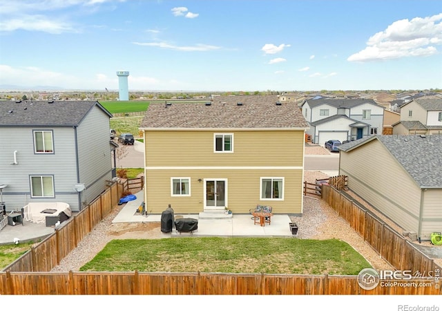 back of property with a patio area, entry steps, and a residential view