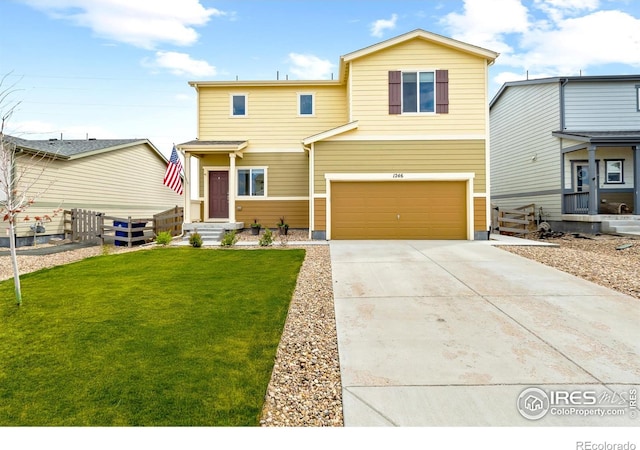 1246 Sherman Dr, Dacono, CO 80514 - view of front of house with concrete driveway and a garage