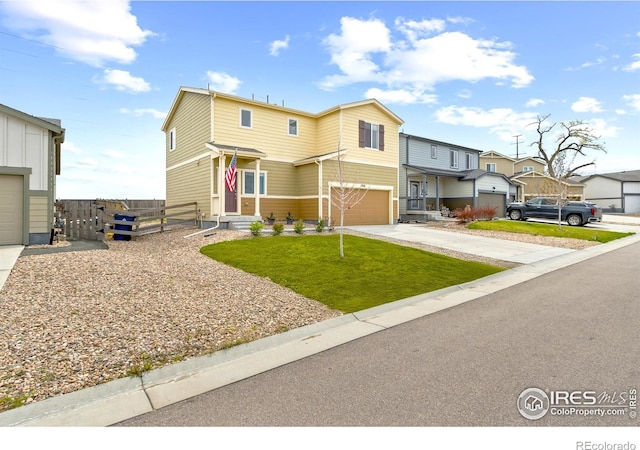 1246 Sherman Dr, Dacono, CO 80514 - view of front of house with concrete driveway, a garage, and a residential view