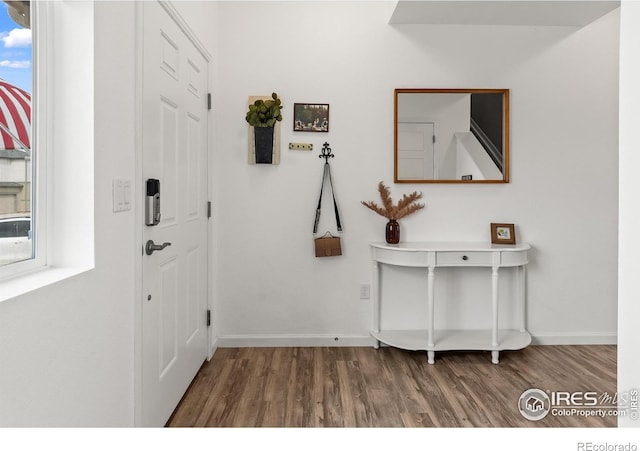 1246 Sherman Dr, Dacono, CO 80514 - foyer with wood finished floors and baseboards