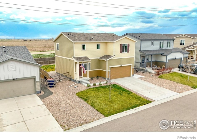 1246 Sherman Dr, Dacono, CO 80514 - view of front facade with concrete driveway and an attached garage
