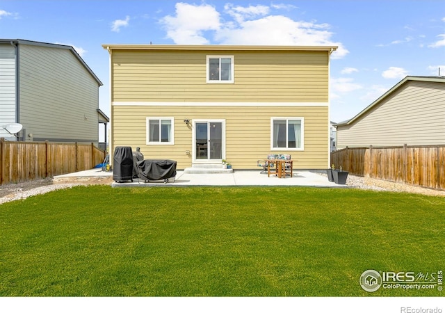 1246 Sherman Dr, Dacono, CO 80514 - back of house featuring a patio and entry steps