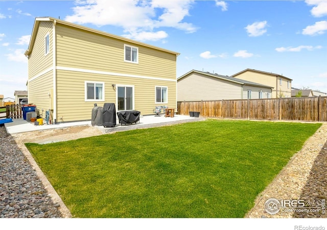 1246 Sherman Dr, Dacono, CO 80514 - rear view of property featuring a patio