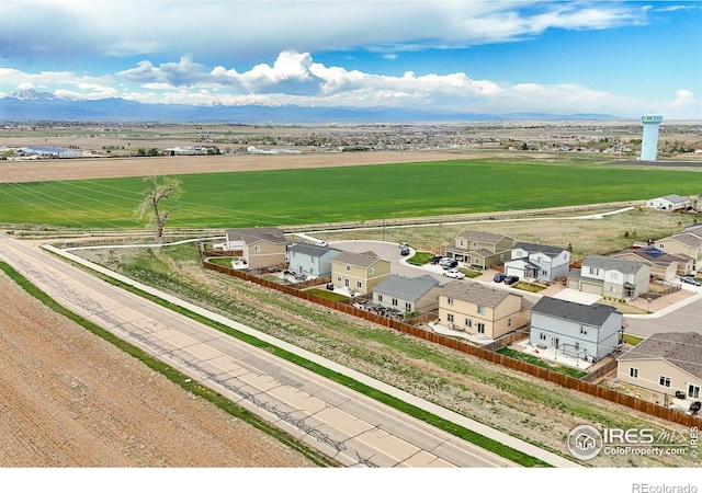 1246 Sherman Dr, Dacono, CO 80514 - aerial perspective of suburban area featuring a mountain backdrop