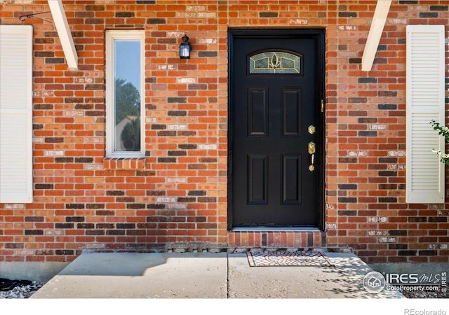 719 Marshall Pl, Berthoud, CO 80513 - property entrance with brick siding