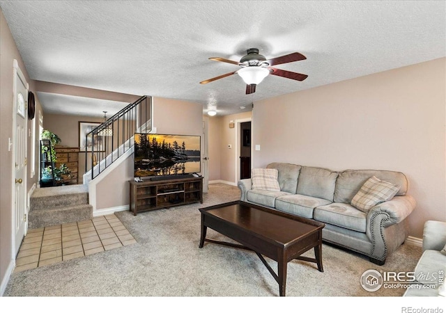 719 Marshall Pl, Berthoud, CO 80513 - carpeted living area featuring a textured ceiling, stairs, ceiling fan, and baseboards