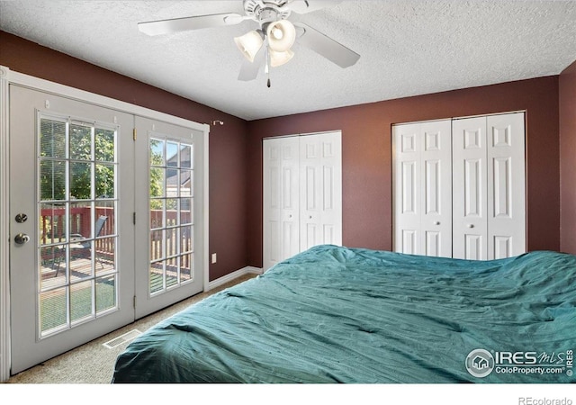 719 Marshall Pl, Berthoud, CO 80513 - carpeted bedroom with access to exterior, multiple closets, a textured ceiling, a ceiling fan, and baseboards