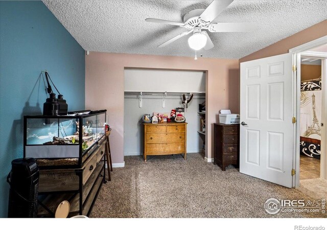 719 Marshall Pl, Berthoud, CO 80513 - bedroom featuring a closet, a textured ceiling, carpet flooring, and a ceiling fan
