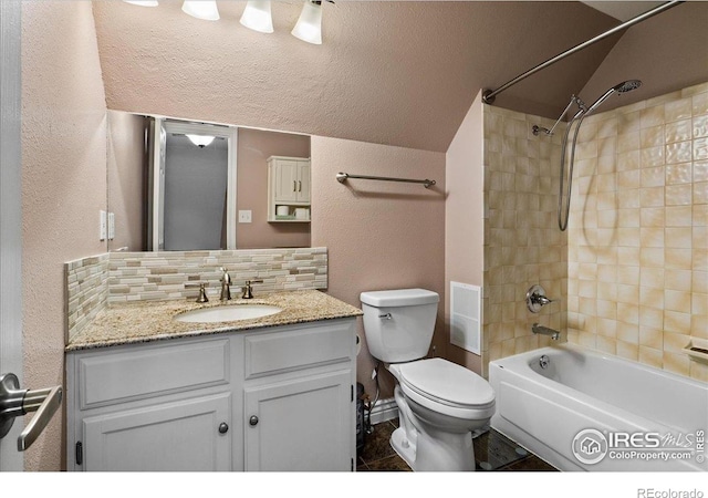 719 Marshall Pl, Berthoud, CO 80513 - full bathroom with backsplash, a textured wall, vanity, toilet, and shower / washtub combination