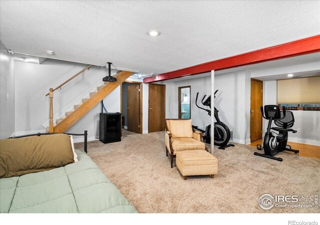 719 Marshall Pl, Berthoud, CO 80513 - living room with a textured ceiling, carpet floors, baseboards, and stairway