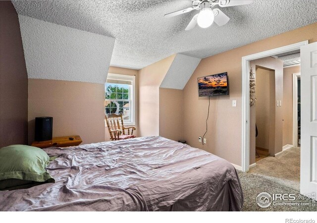 719 Marshall Pl, Berthoud, CO 80513 - bedroom featuring carpet flooring, a textured ceiling, and a ceiling fan