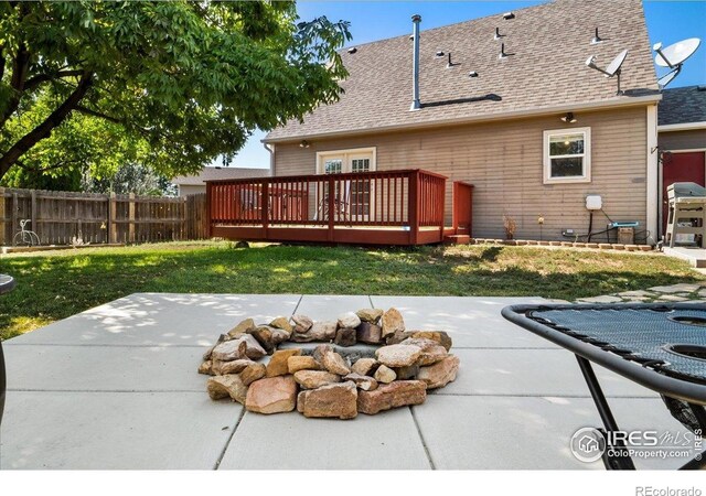 719 Marshall Pl, Berthoud, CO 80513 - back of house featuring a wooden deck, a fire pit, a patio, and roof with shingles