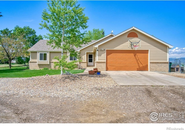 2212 S County Road 15th Rd, Berthoud, CO 80513 - single story home featuring brick siding, concrete driveway, and a front yard