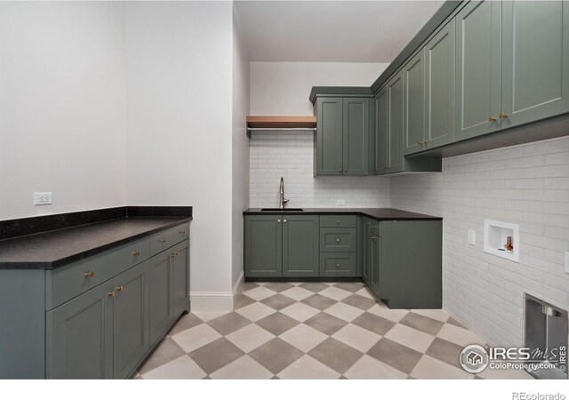 951 Warbling Dr, Windsor, CO 80550 - laundry area featuring cabinet space, light flooring, washer hookup, and baseboards