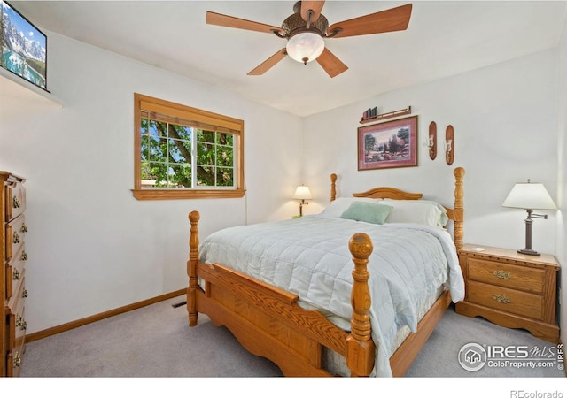 5930 Mars Dr, Fort Collins, CO 80525 - carpeted bedroom with baseboards and ceiling fan