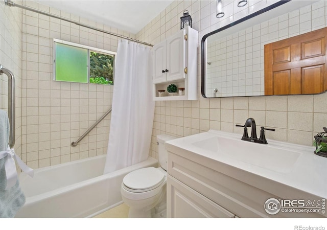 5930 Mars Dr, Fort Collins, CO 80525 - bathroom with tile walls, shower / tub combo with curtain, toilet, vanity, and decorative backsplash