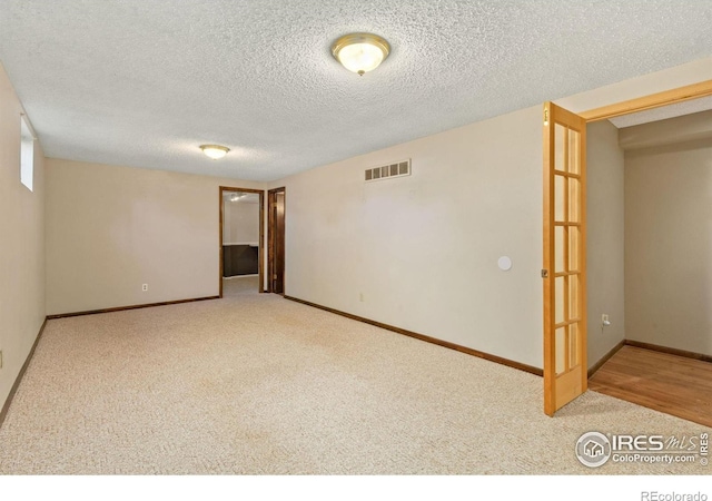5930 Mars Dr, Fort Collins, CO 80525 - unfurnished room featuring carpet, a textured ceiling, and baseboards