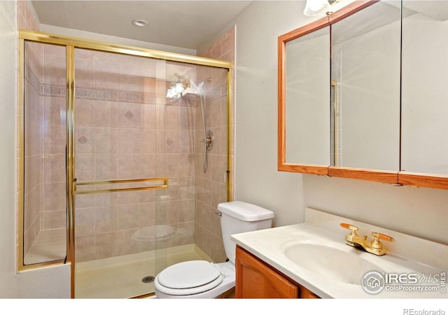 5930 Mars Dr, Fort Collins, CO 80525 - full bathroom with a stall shower, toilet, and vanity