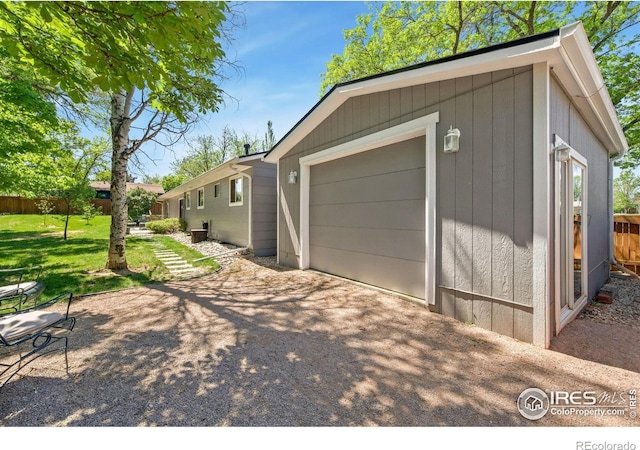 5930 Mars Dr, Fort Collins, CO 80525 - garage with asphalt driveway