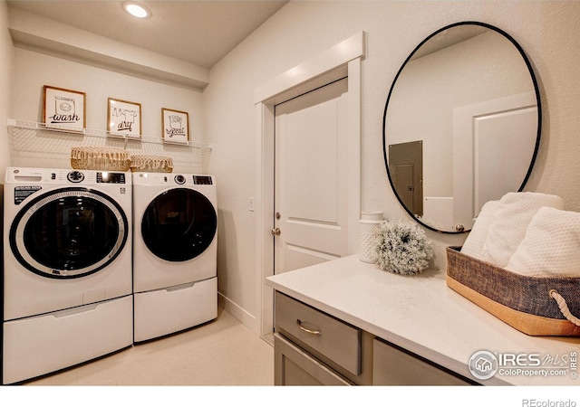 washroom with washing machine and dryer, electric panel, and recessed lighting