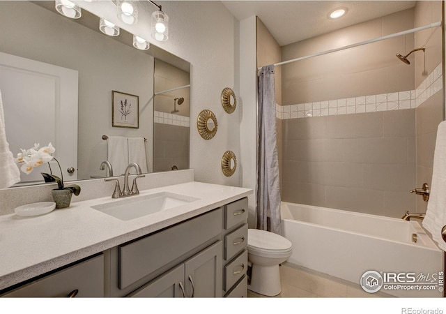 bathroom with shower / bath combination with curtain, toilet, tile patterned floors, and vanity