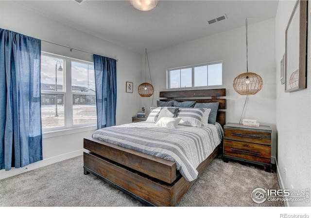bedroom featuring carpet floors and baseboards