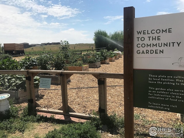 exterior view of a vegetable garden and fence