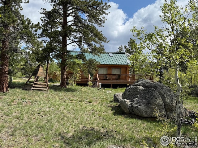 588 Yuki Dr, Red Feather Lakes, CO 80545 - view of yard featuring a deck