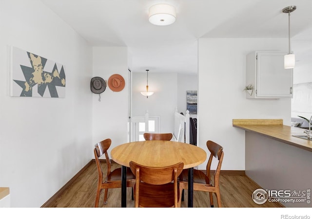 1013 Alsace Way, Lafayette, CO 80026 - dining space featuring wood finished floors and baseboards