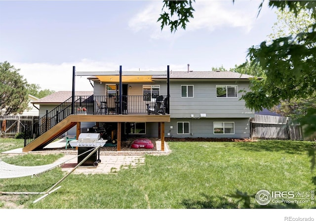 1013 Alsace Way, Lafayette, CO 80026 - rear view of property featuring stairway, a wooden deck, and a patio area