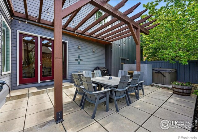 5145 Denver St, Boulder, CO 80304 - view of patio featuring a pergola, outdoor dining space, a hot tub, and fence