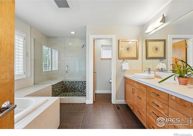 5145 Denver St, Boulder, CO 80304 - full bath with a shower stall, vanity, a garden tub, baseboards, and recessed lighting