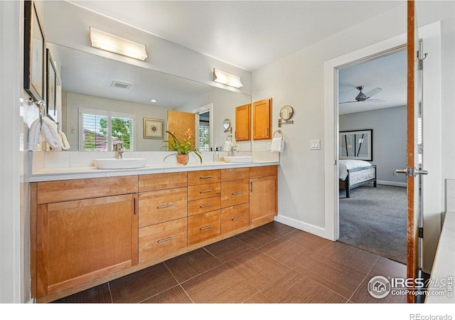 5145 Denver St, Boulder, CO 80304 - full bath with connected bathroom, double vanity, baseboards, and a ceiling fan