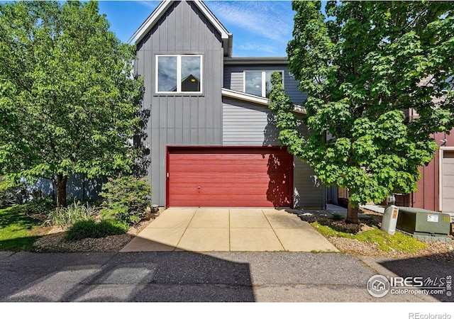 5145 Denver St, Boulder, CO 80304 - multi unit property featuring board and batten siding, a garage, and asphalt driveway