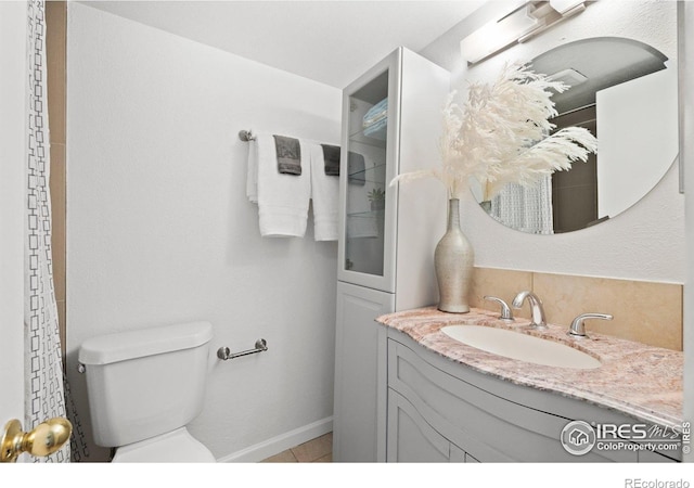 full bath with toilet and vanity