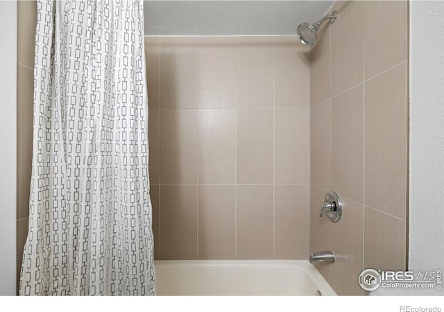bathroom featuring shower / bathtub combination with curtain