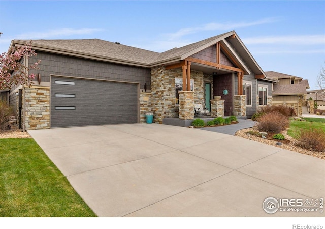 660 Deer Meadow Dr, Loveland, CO 80537 - craftsman inspired home with stone siding, driveway, a garage, and a shingled roof