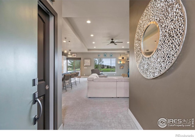 660 Deer Meadow Dr, Loveland, CO 80537 - living room with a ceiling fan, baseboards, recessed lighting, and a tray ceiling