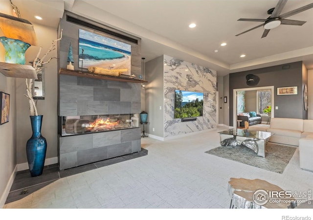 660 Deer Meadow Dr, Loveland, CO 80537 - living room with recessed lighting, a tile fireplace, a ceiling fan, and baseboards