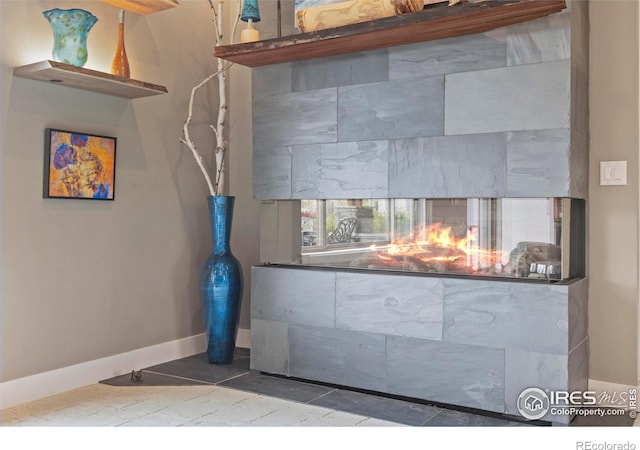 660 Deer Meadow Dr, Loveland, CO 80537 - detailed view of a multi sided fireplace and baseboards