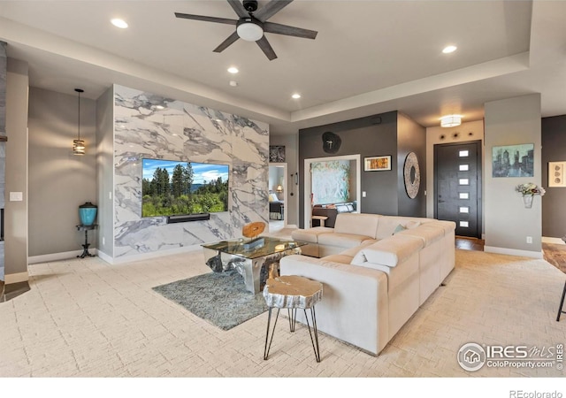 660 Deer Meadow Dr, Loveland, CO 80537 - living room featuring recessed lighting, a ceiling fan, a tray ceiling, and baseboards