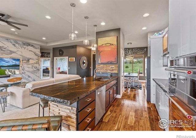 660 Deer Meadow Dr, Loveland, CO 80537 - kitchen featuring a sink, stainless steel appliances, light wood-type flooring, recessed lighting, and ceiling fan