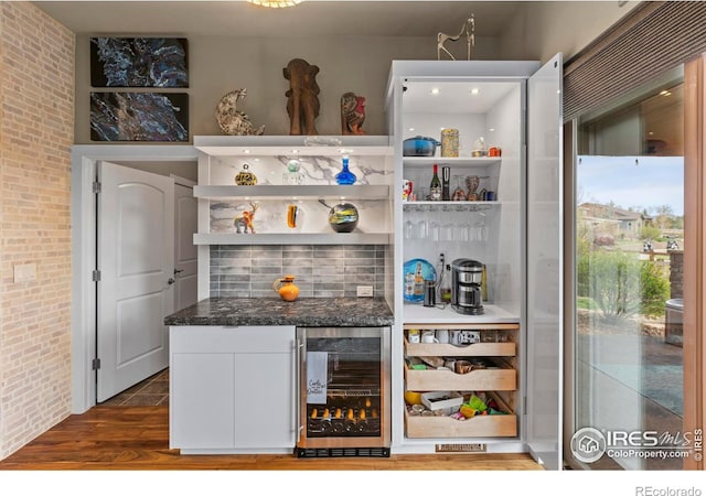 660 Deer Meadow Dr, Loveland, CO 80537 - indoor dry bar with wine cooler, dark wood-style floors, and brick wall