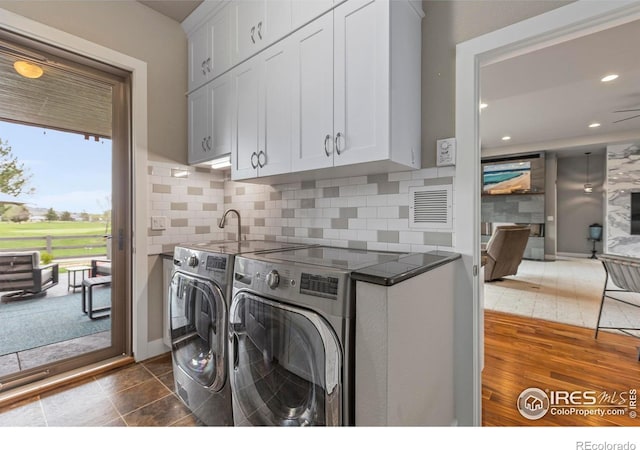 660 Deer Meadow Dr, Loveland, CO 80537 - laundry area with cabinet space, separate washer and dryer, and recessed lighting