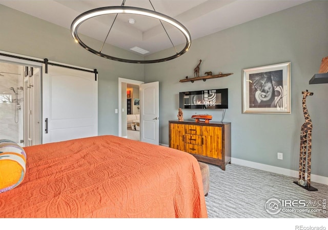 660 Deer Meadow Dr, Loveland, CO 80537 - carpeted bedroom with a barn door and baseboards