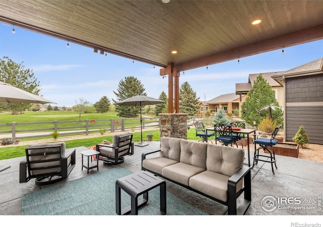 660 Deer Meadow Dr, Loveland, CO 80537 - view of patio / terrace with an outdoor living space and outdoor dining area