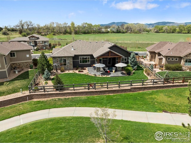 660 Deer Meadow Dr, Loveland, CO 80537 - view of front of property featuring a patio and a mountain view