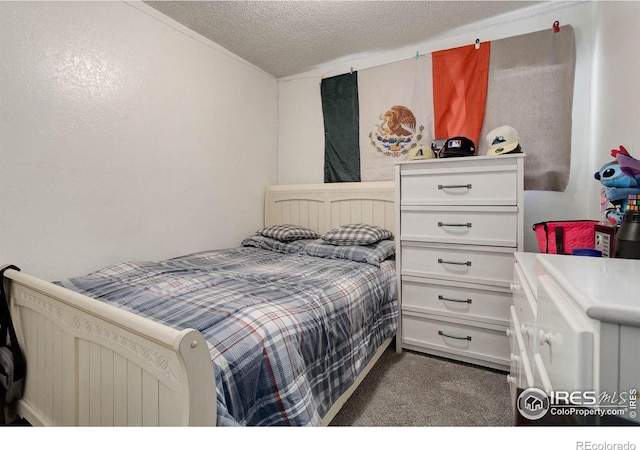 3030 Oneal Pkwy Unit 10, Boulder, CO 80301 - bedroom featuring dark colored carpet and a textured ceiling