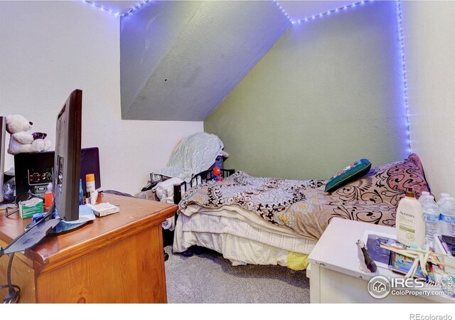 3030 Oneal Pkwy Unit 10, Boulder, CO 80301 - bedroom with lofted ceiling and carpet flooring