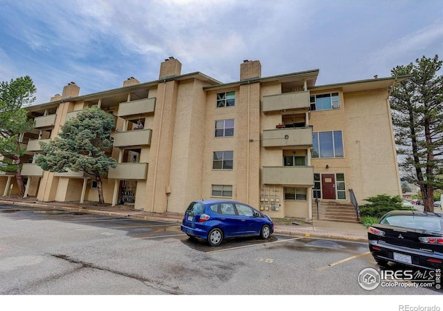 3030 Oneal Pkwy Unit 10, Boulder, CO 80301 - view of apartment building / complex featuring uncovered parking